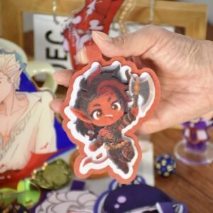 Baldur's Gate 3 Karlach felt charm held in a hand